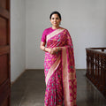 Pink Kutch Bandhani Fine Georgette Banarasi Neem Zari Jaal Saree, draped and worn by a woman, AI visual of the saree, iTokri