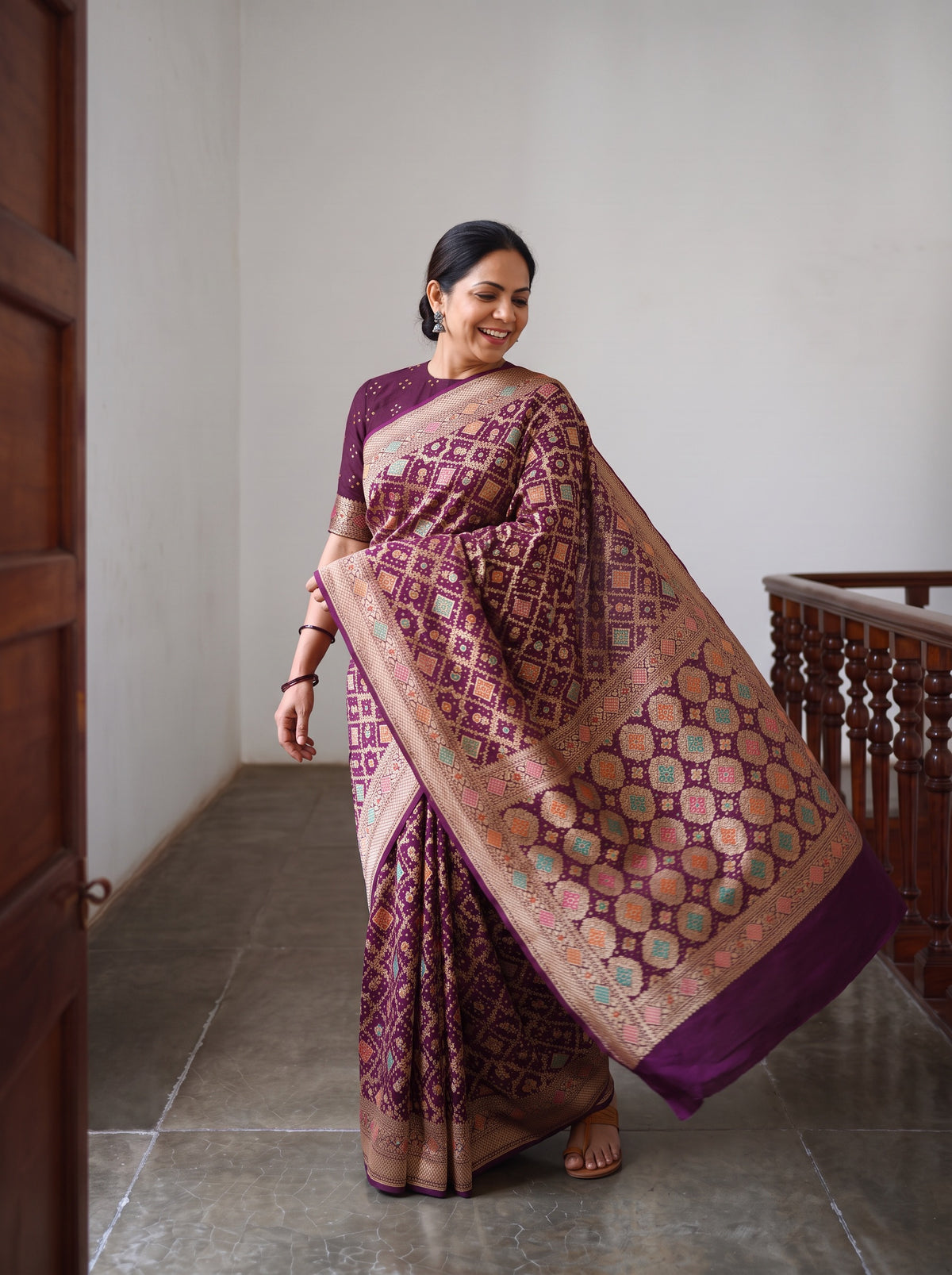 Maroon Kutch Bandhani Fine Georgette Banarasi Neem Zari Jaal Saree, draped and worn by a woman, AI visual of the saree, iTokri