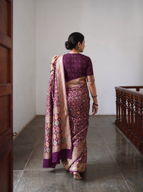 Maroon Kutch Bandhani Fine Georgette Banarasi Neem Zari Jaal Saree, draped and worn by a woman, AI visual of the saree, iTokri
