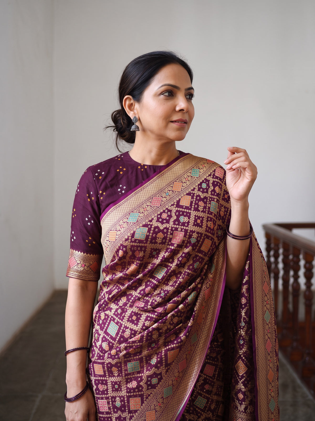 Maroon Kutch Bandhani Fine Georgette Banarasi Neem Zari Jaal Saree, draped and worn by a woman, AI visual of the saree, iTokri