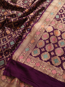 Maroon Kutch Bandhani Fine Georgette Banarasi Neem Zari Jaal Saree, draped and worn by a woman, AI visual of the saree, iTokri