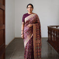 Maroon Kutch Bandhani Fine Georgette Banarasi Neem Zari Jaal Saree, draped and worn by a woman, AI visual of the saree, iTokri