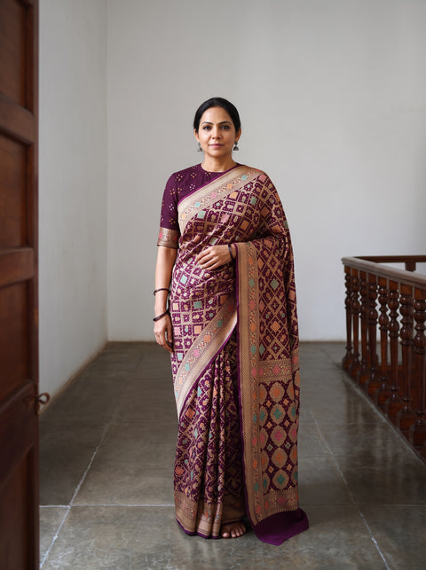 Maroon Kutch Bandhani Fine Georgette Banarasi Neem Zari Jaal Saree, draped and worn by a woman, AI visual of the saree, iTokri