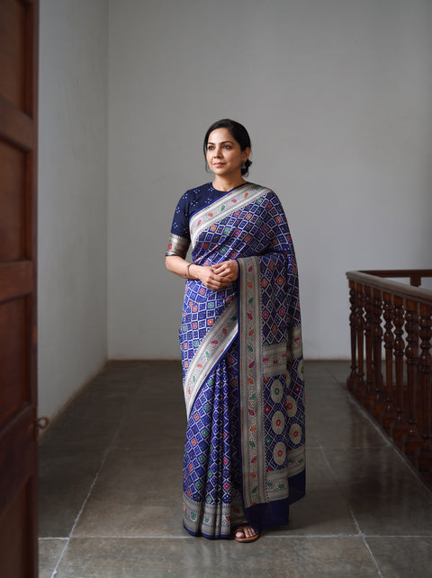 Blue Kutch Bandhani Fine Georgette Banarasi Neem Zari Jaal Saree, draped and worn by a woman, AI visual of the saree, iTokri