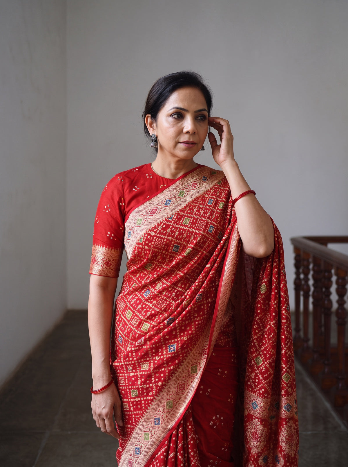 Red Kutch Bandhani Fine Georgette Banarasi Neem Zari Jaal Saree, draped and worn by a woman, AI visual of the saree, iTokri