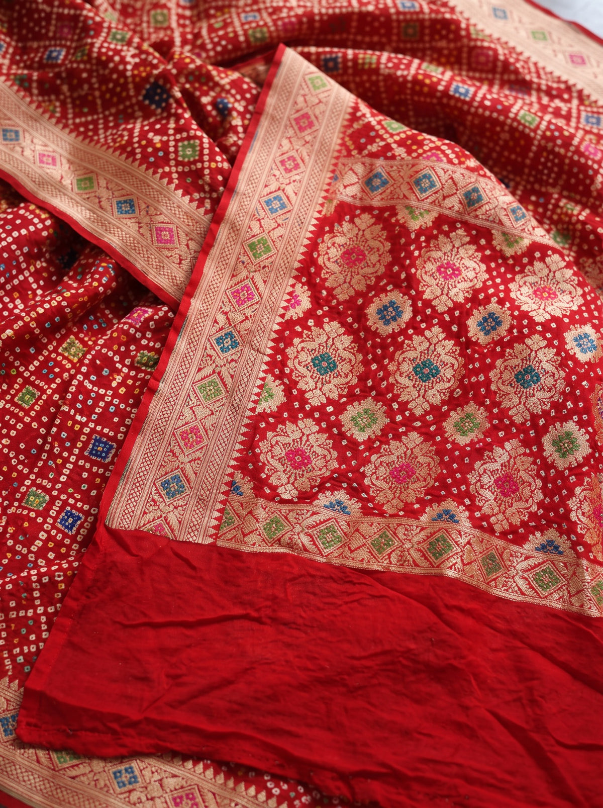 Red Kutch Bandhani Fine Georgette Banarasi Neem Zari Jaal Saree, draped and worn by a woman, AI visual of the saree, iTokri