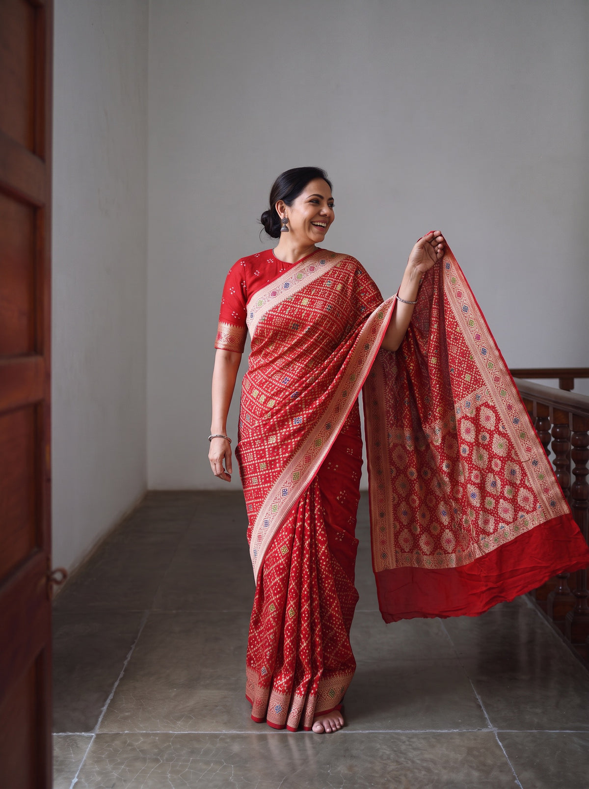 Red Kutch Bandhani Fine Georgette Banarasi Neem Zari Jaal Saree, draped and worn by a woman, AI visual of the saree, iTokri