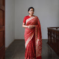 Red Kutch Bandhani Fine Georgette Banarasi Neem Zari Jaal Saree, draped and worn by a woman, AI visual of the saree, iTokri