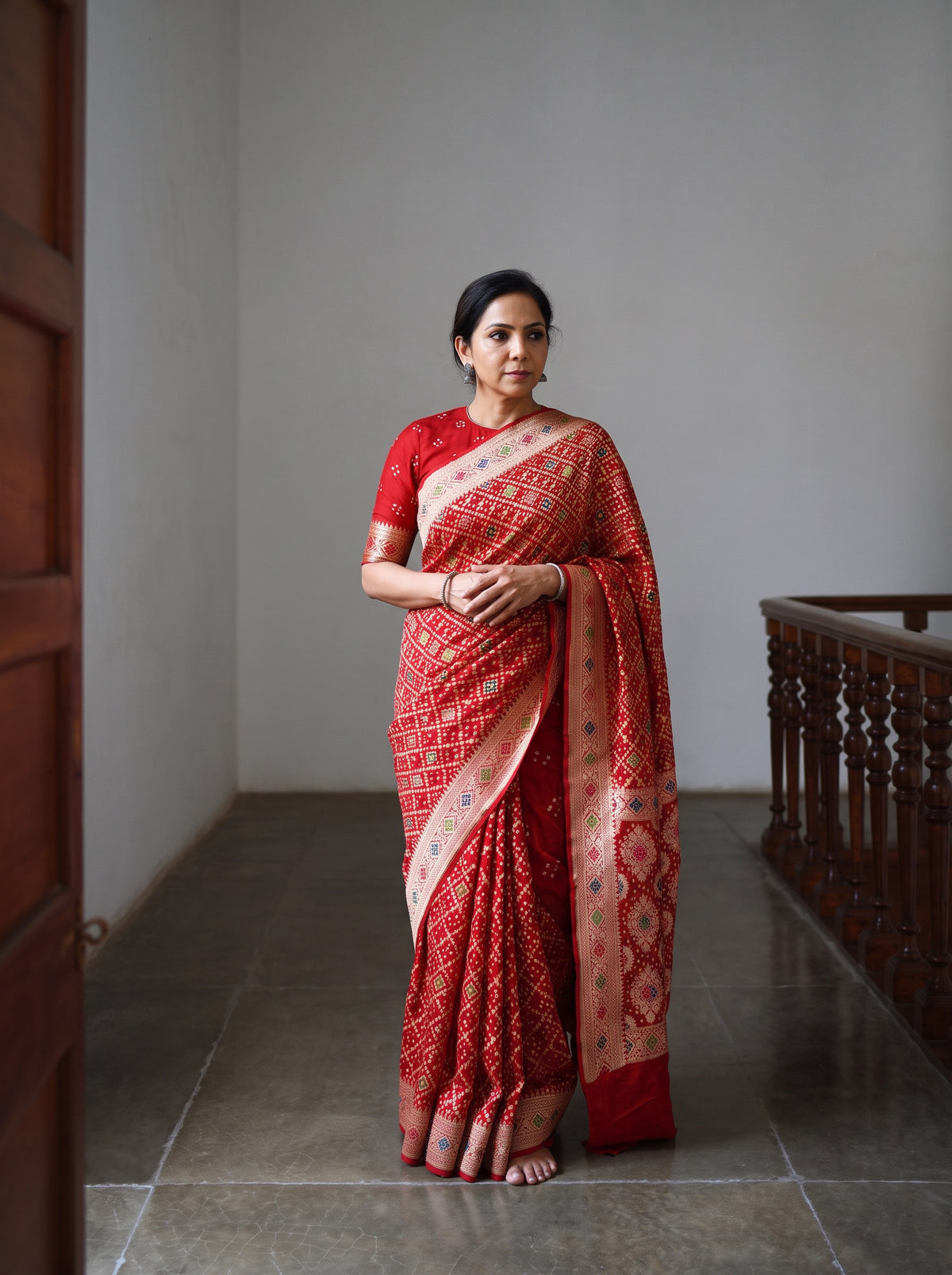Red Kutch Bandhani Fine Georgette Banarasi Neem Zari Jaal Saree, draped and worn by a woman, AI visual of the saree, iTokri