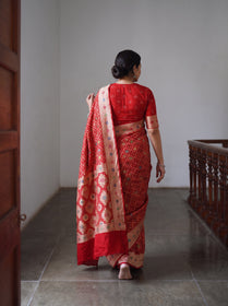 Red Kutch Bandhani Fine Georgette Banarasi Neem Zari Jaal Saree, draped and worn by a woman, AI visual of the saree, iTokri