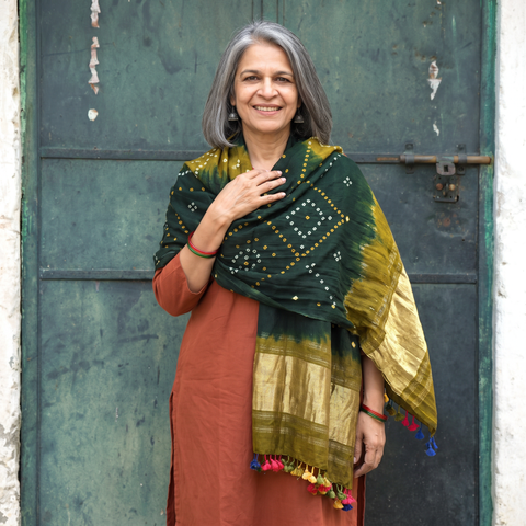 Green Kutch Bandhani Handwoven Merino Wool Shawl with Zari Patta, worn by a model, AI visual of the shawl, iTokri
