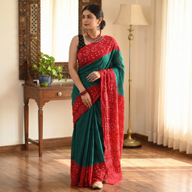 Green and red Kutch Bandhani tie-dye cotton saree, draped and worn by a woman, AI visual of the saree, iTokri
