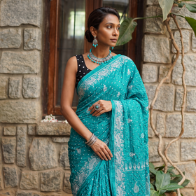Green Kutch Bandhani tie-dye cotton saree, draped and worn by a woman, AI visual of the saree, iTokri