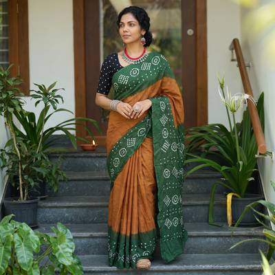 Green and brown Kutch Bandhani tie-dye cotton saree, draped and worn by a woman, AI visual of the saree, iTokri