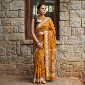 Yellow Kutch Bandhani tie-dye cotton saree, draped and worn by a woman, AI visual of the saree, iTokri