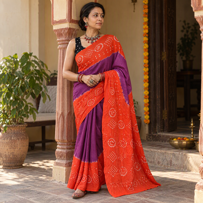 Orange and purple Kutch Bandhani tie-dye cotton saree, draped and worn by a woman, AI visual of the saree, iTokri
