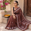 Brown Kutch Bandhani tie-dye cotton saree, draped and worn by a woman, AI visual of the saree, iTokri