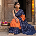 Blue and orange Kutch Bandhani tie-dye cotton saree, draped and worn by a woman, AI visual of the saree, iTokri