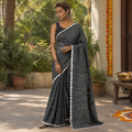 Grey Kutch Bandhani tie-dye cotton saree, draped and worn by a woman, AI visual of the saree, iTokri