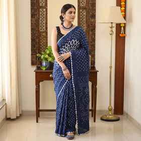 Blue Kutch Bandhani tie-dye cotton saree, draped and worn by a woman, AI visual of the saree, iTokri