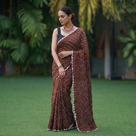 Brown Kutch Bandhani tie-dye cotton saree, draped and worn by a woman, AI visual of the saree, iTokri