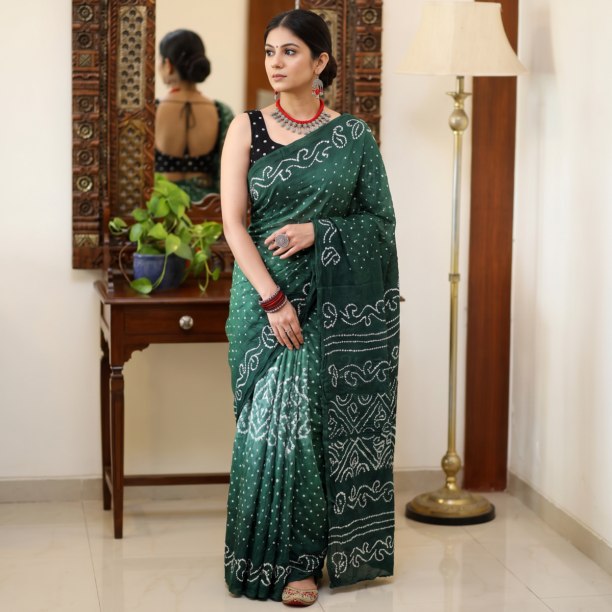 Green Kutch Bandhani tie-dye cotton saree, draped and worn by a woman, AI visual of the saree, iTokri
