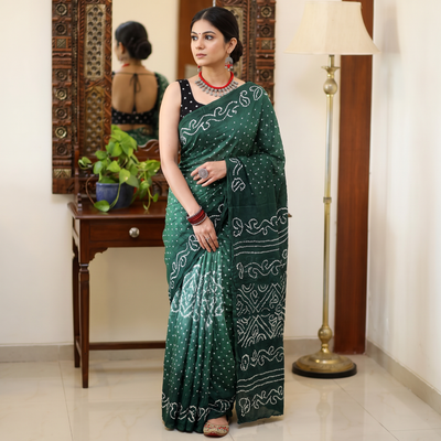Green Kutch Bandhani tie-dye cotton saree, draped and worn by a woman, AI visual of the saree, iTokri