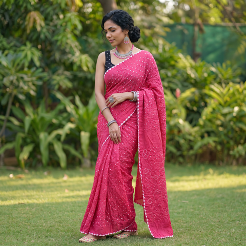 Pink Kutch Bandhani tie-dye cotton saree, draped and worn by a woman, AI visual of the saree, iTokri