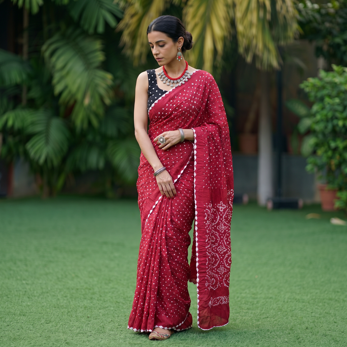 Pink Kutch Bandhani tie-dye cotton saree, draped and worn by a woman, AI visual of the saree, iTokri