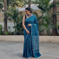 Blue Kutch Bandhani tie-dye cotton saree, draped and worn by a woman, AI visual of the saree, iTokri