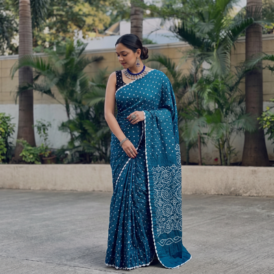 Blue Kutch Bandhani tie-dye cotton saree, draped and worn by a woman, AI visual of the saree, iTokri