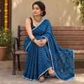 Blue Kutch Bandhani tie-dye cotton saree, draped and worn by a woman, AI visual of the saree, iTokri