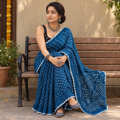 Blue Kutch Bandhani tie-dye cotton saree, draped and worn by a woman, AI visual of the saree, iTokri