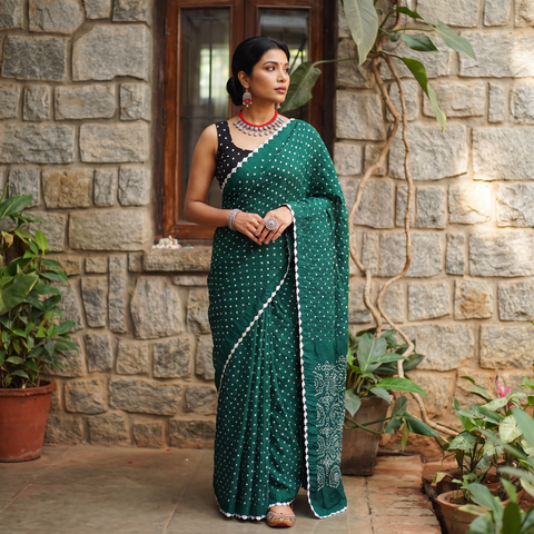 Green Kutch Bandhani tie-dye cotton saree, draped and worn by a woman, AI visual of the saree, iTokri