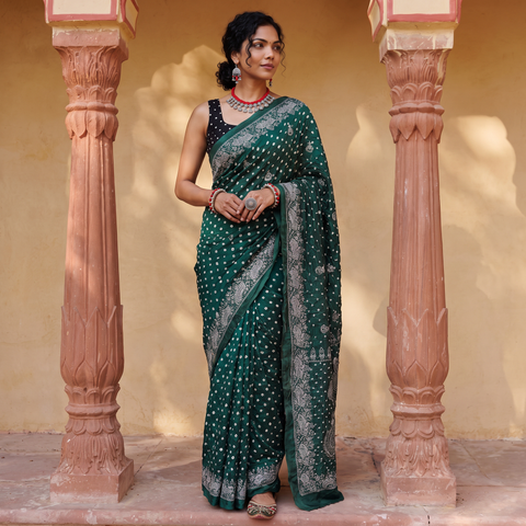 Green Kutch Bandhani tie-dye cotton saree, draped and worn by a woman, AI visual of the saree, iTokri