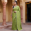 Green Kutch Bandhani tie-dye cotton saree, draped and worn by a woman, AI visual of the saree, iTokri
