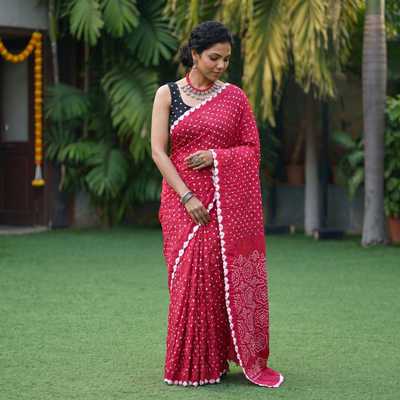 Pink Kutch Bandhani tie-dye cotton saree, draped and worn by a woman, AI visual of the saree, iTokri