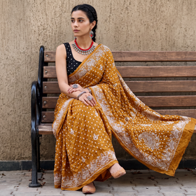 Yellow Kutch Bandhani tie-dye cotton saree, draped and worn by a woman, AI visual of the saree, iTokri