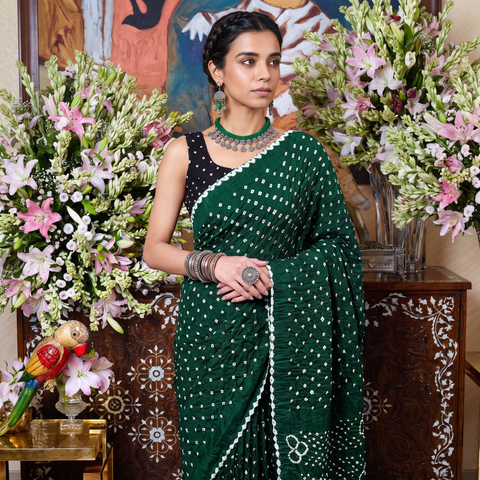 Green Kutch Bandhani tie-dye cotton saree, draped and worn by a woman, AI visual of the saree, iTokri