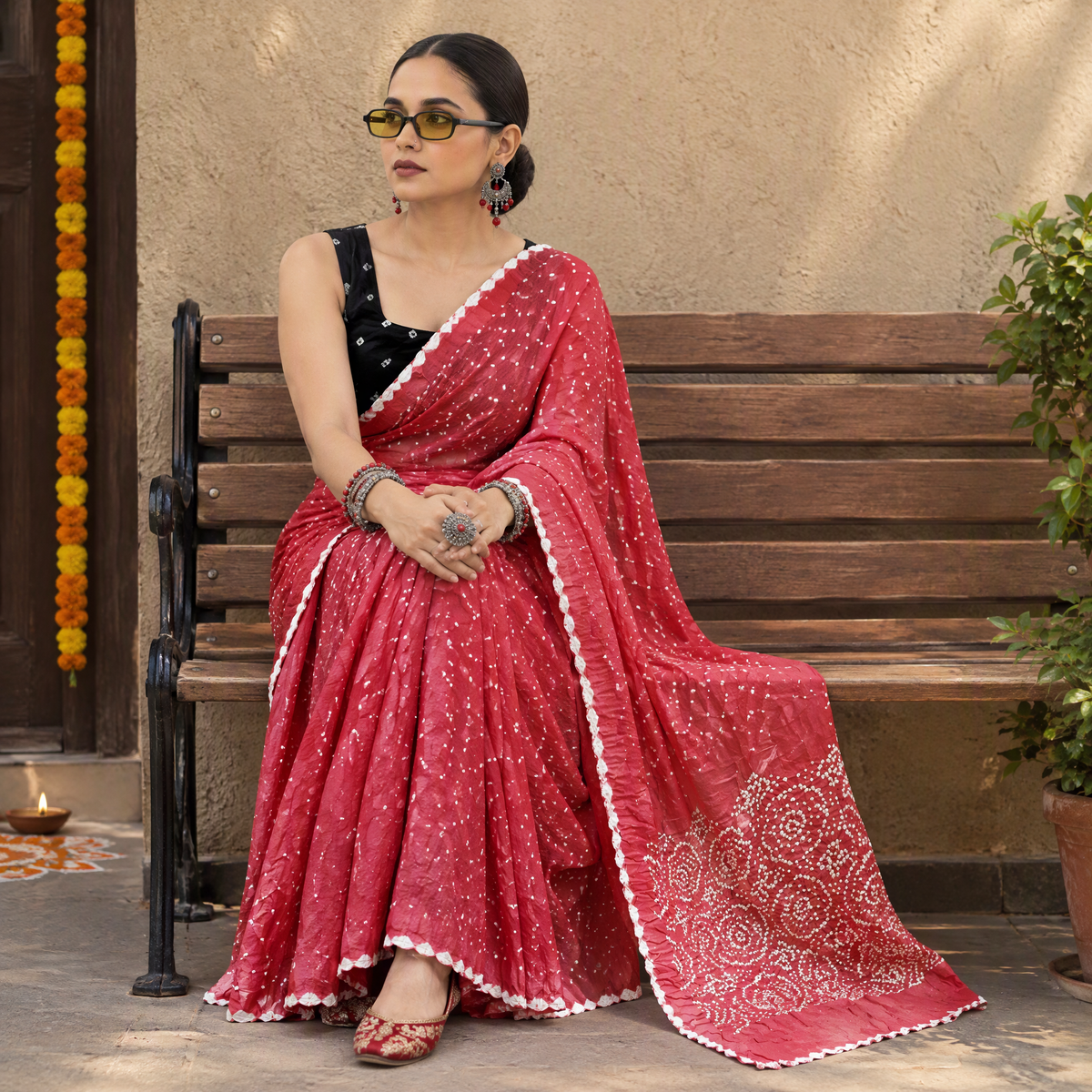 Pink Kutch Bandhani tie-dye cotton saree, draped and worn by a woman, AI visual of the saree, iTokri