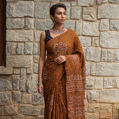 Brown Kutch Bandhani tie-dye cotton saree, draped and worn by a woman, AI visual of the saree, iTokri