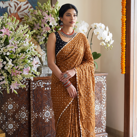 Yellow Kutch Bandhani tie-dye cotton saree, draped and worn by a woman, AI visual of the saree, iTokri