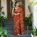Orange Kutch Bandhani tie-dye cotton saree, draped and worn by a woman, AI visual of the saree, iTokri