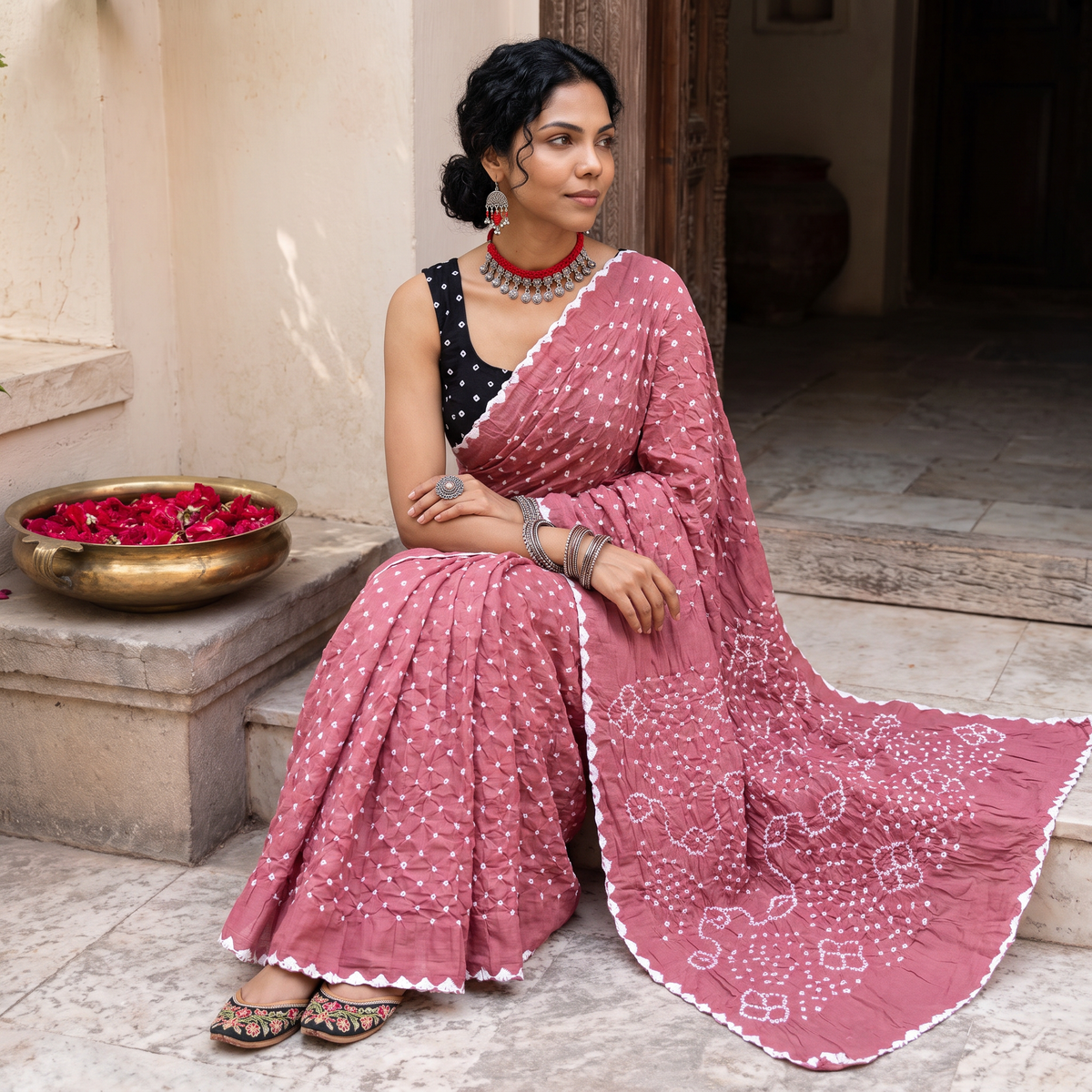 Pink Kutch Bandhani tie-dye cotton saree, draped and worn by a woman, AI visual of the saree, iTokri