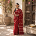 Red Kutch Bandhani tie-dye cotton saree, draped and worn by a woman, AI visual of the saree, iTokri