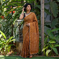 Yellow Kutch Bandhani tie-dye cotton saree, draped and worn by a woman, AI visual of the saree, iTokri