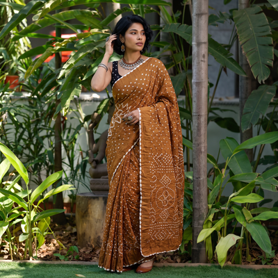 Yellow Kutch Bandhani tie-dye cotton saree, draped and worn by a woman, AI visual of the saree, iTokri