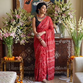 Pink Kutch Bandhani tie-dye cotton saree, draped and worn by a woman, AI visual of the saree, iTokri