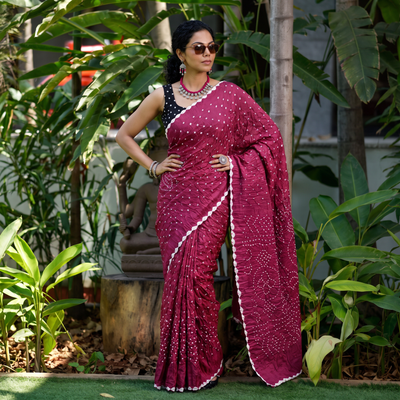 Pink Kutch Bandhani tie-dye cotton saree, draped and worn by a woman, AI visual of the saree, iTokri