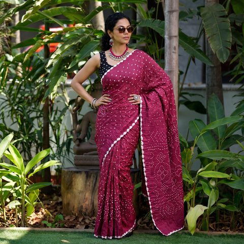 Pink Kutch Bandhani tie-dye cotton saree, draped and worn by a woman, AI visual of the saree, iTokri